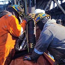 two field workers installing cable